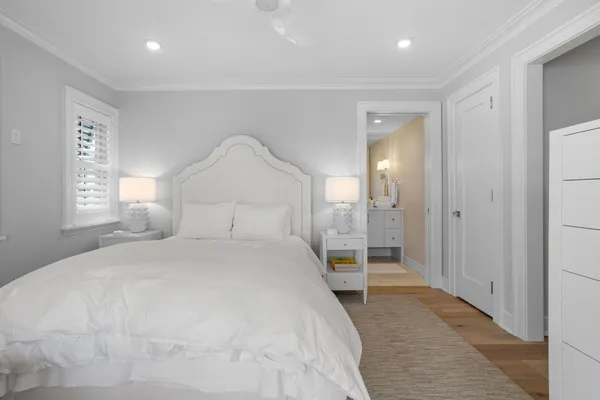 a large white bed in a white room