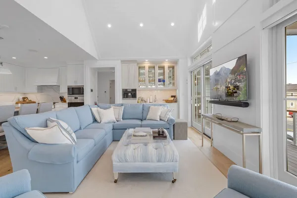 a large kitchen with stainless steel appliances lots of counter space and a sink