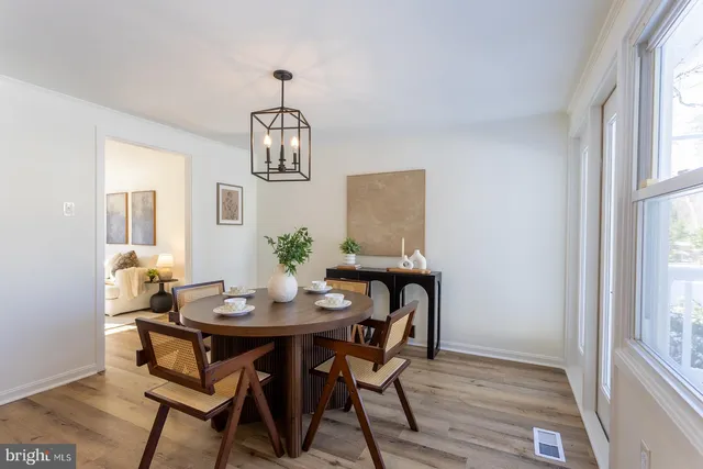 a kitchen with stainless steel appliances granite countertop wooden floors and stove top oven