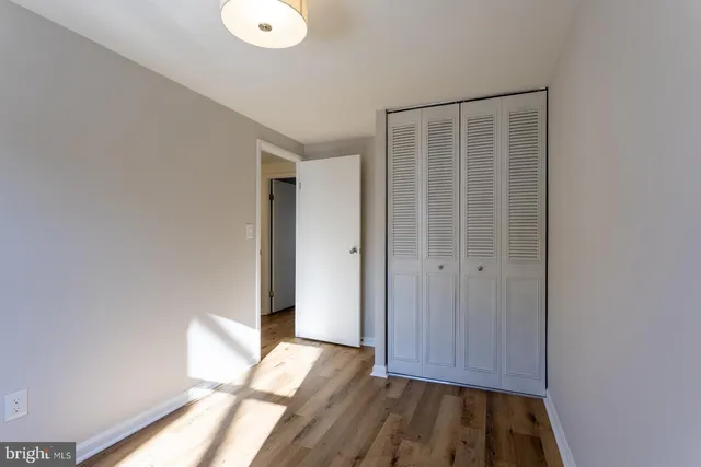 a view of walk in closet with empty room