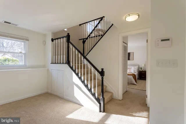 a bedroom with bed and a window