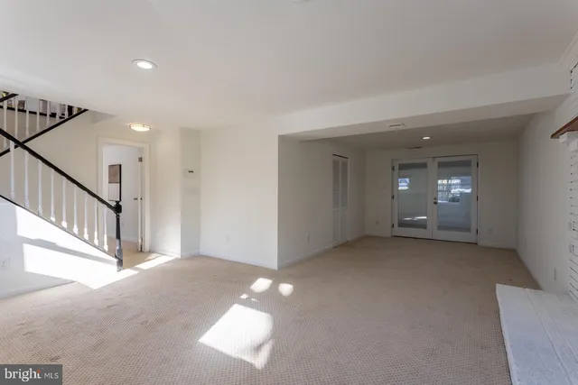 a view of road with card parked on side and road