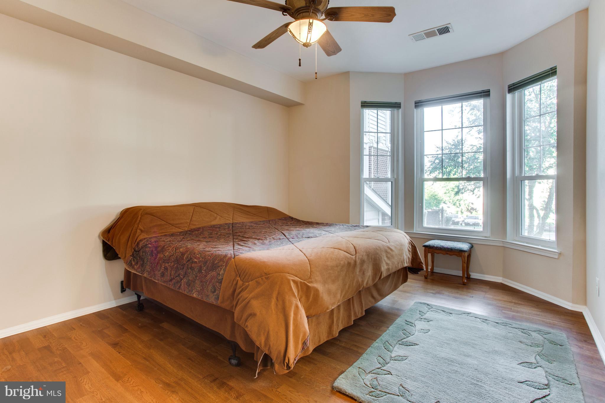 1600 Spring Gate Dr., Unit 2207 McLean, VA 22102 - Photo 15 of 29 a bedroom with a bed and window
