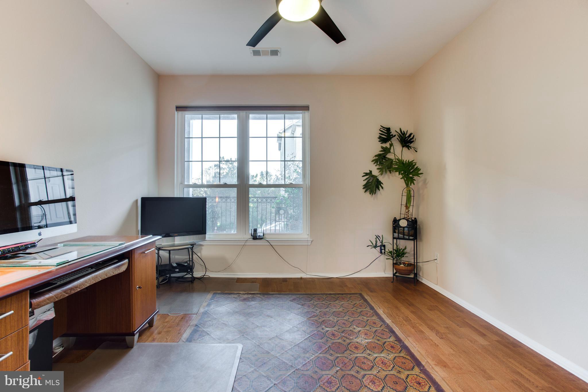 1600 Spring Gate Dr., Unit 2207 McLean, VA 22102 - Photo 19 of 29 a view of a workspace with furniture and a window