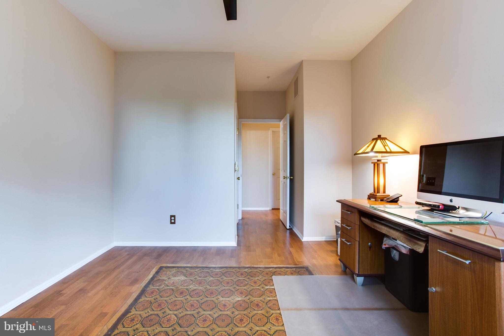 1600 Spring Gate Dr., Unit 2207 McLean, VA 22102 - Photo 20 of 29 a workspace with furniture and mirror