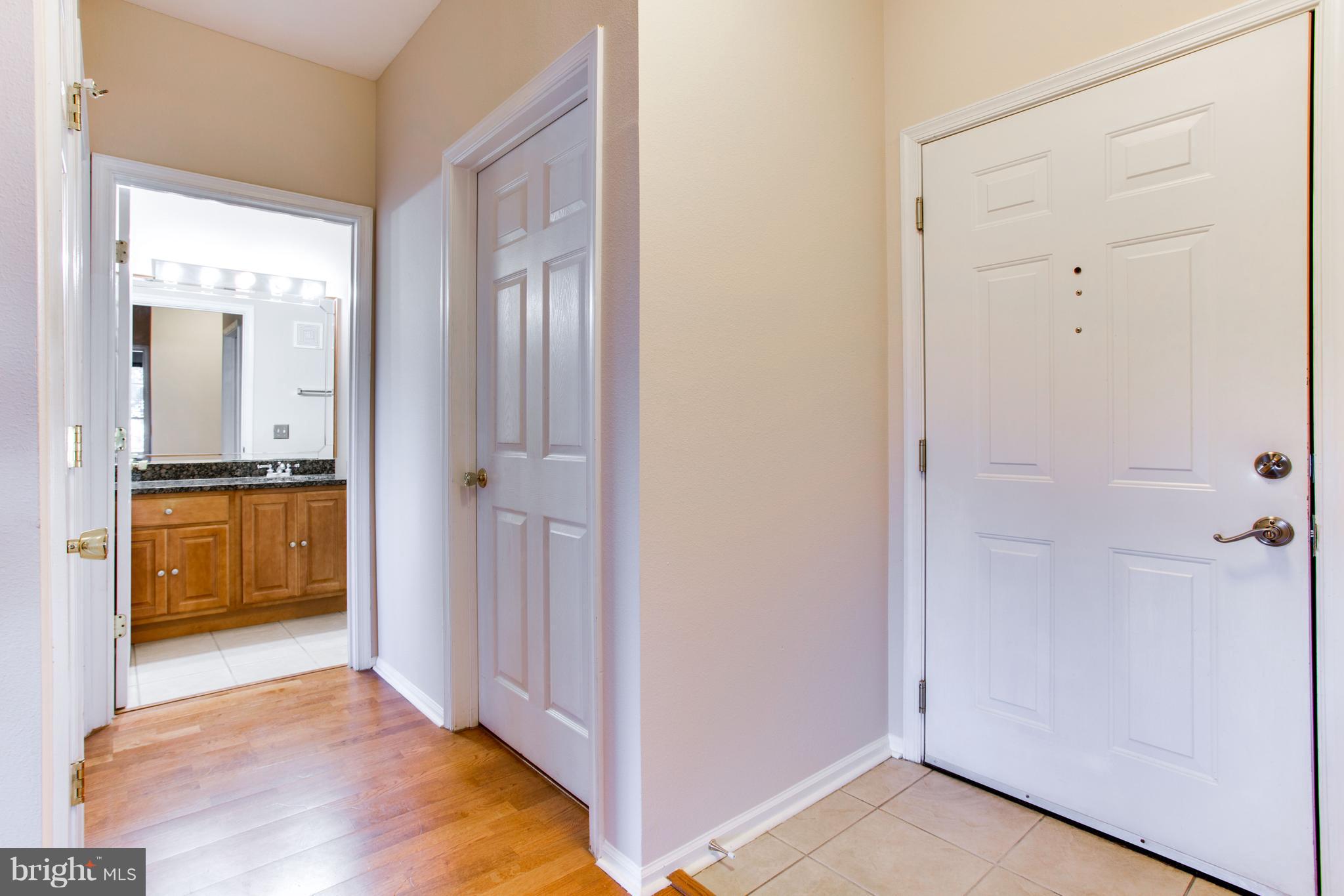 1600 Spring Gate Dr., Unit 2207 McLean, VA 22102 - Photo 4 of 29 a view of a bathroom with a tub and shower
