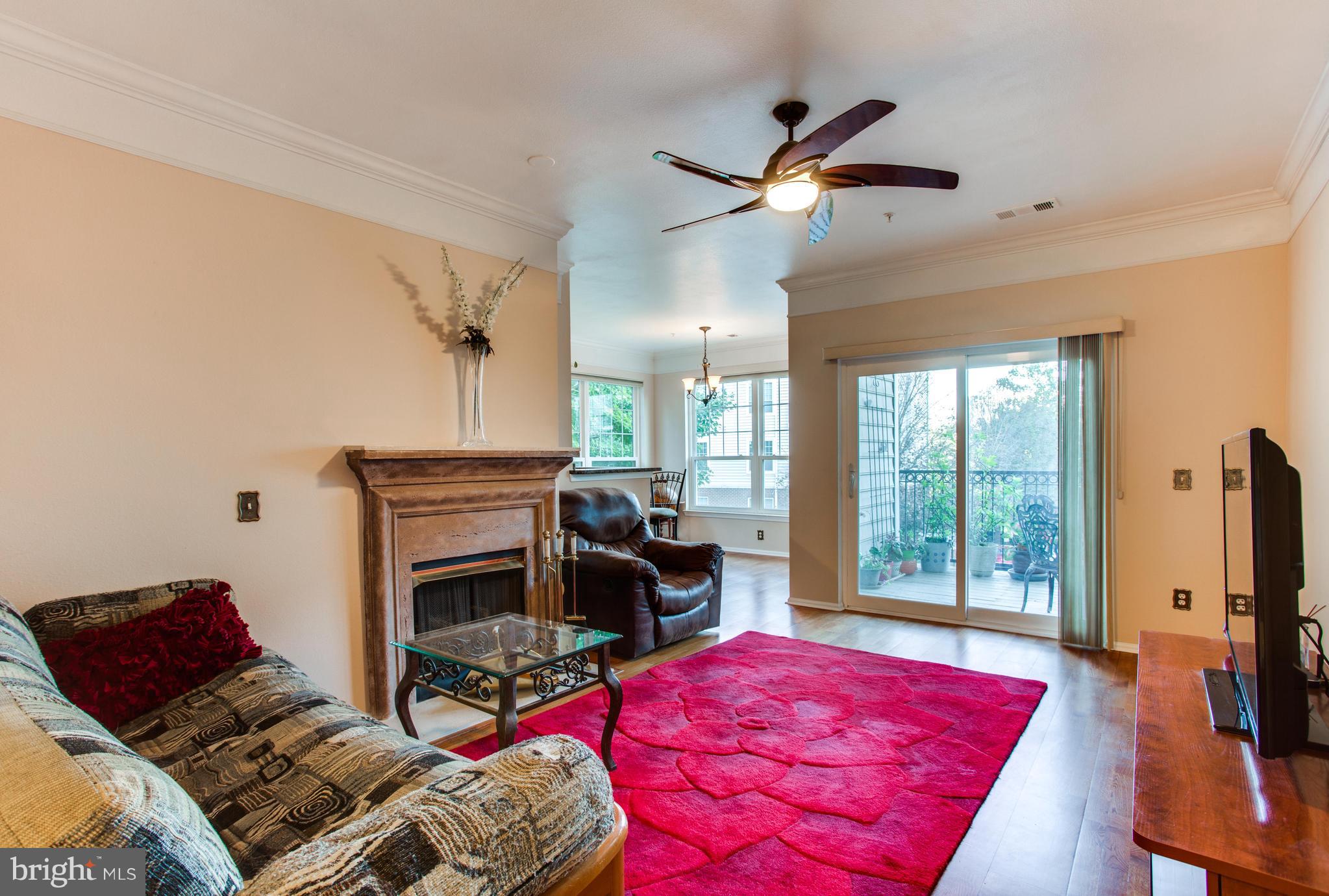 1600 Spring Gate Dr., Unit 2207 McLean, VA 22102 - Photo 6 of 29 a bedroom with furniture and a flat screen tv