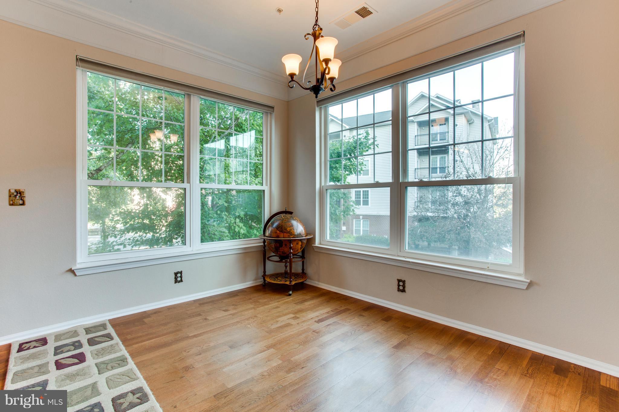 1600 Spring Gate Dr., Unit 2207 McLean, VA 22102 - Photo 9 of 29 a view of livingroom with furniture and window
