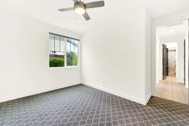 a view of a livingroom with a ceiling fan