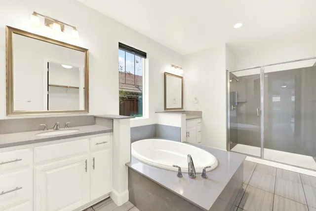 a kitchen with a sink a counter space and a chandelier