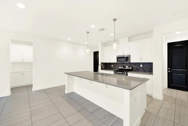 a outdoor living space with patio furniture and a potted plant
