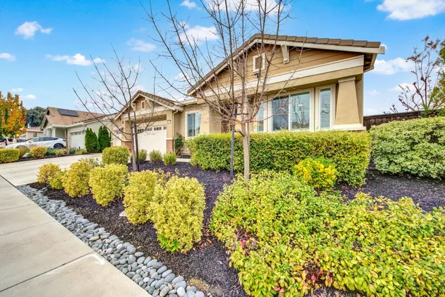 a front view of a house with a yard