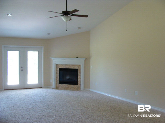 226 Meadow Run Loop Foley, AL 36535 - Photo 5 of 22 Electric fireplace in the large family room.
