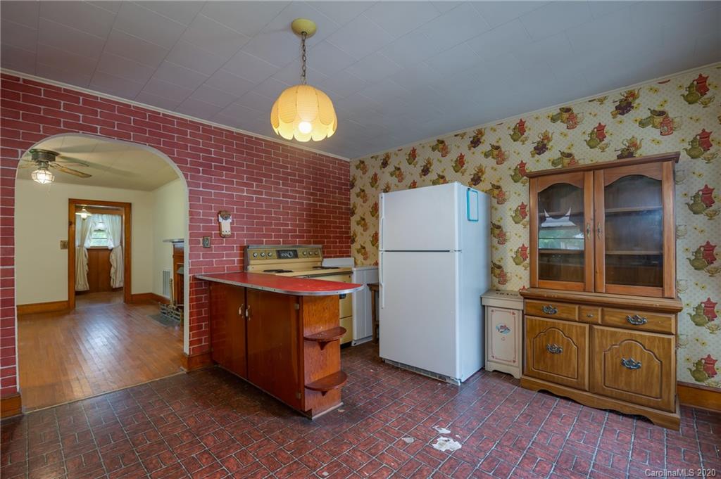 428 Kelly Road Forest City, NC 28043 - Photo 12 of 24 a view of a kitchen with furniture and wooden floor