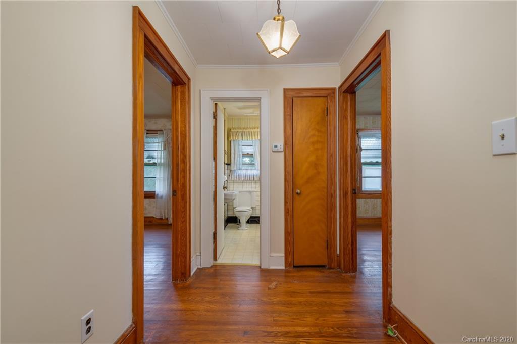 428 Kelly Road Forest City, NC 28043 - Photo 17 of 24 a view of a hallway with wooden floor
