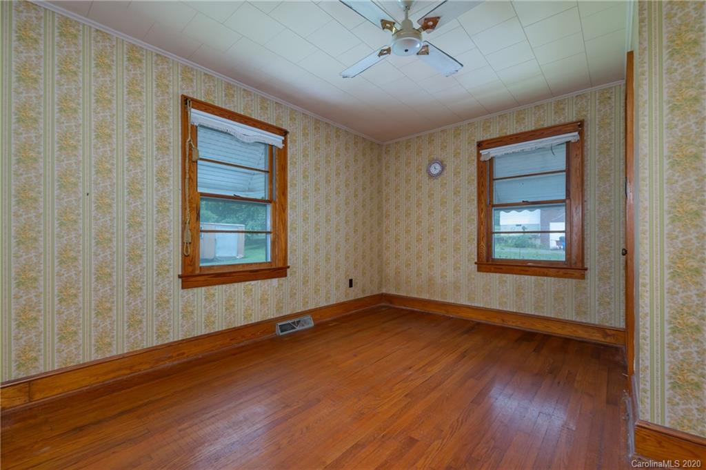 428 Kelly Road Forest City, NC 28043 - Photo 18 of 24 a view of an empty room with wooden floor and a window