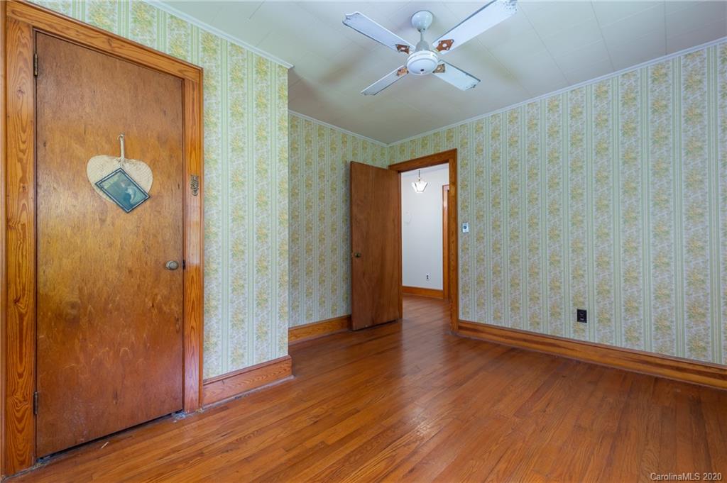 428 Kelly Road Forest City, NC 28043 - Photo 19 of 24 an empty room with wooden floor and windows
