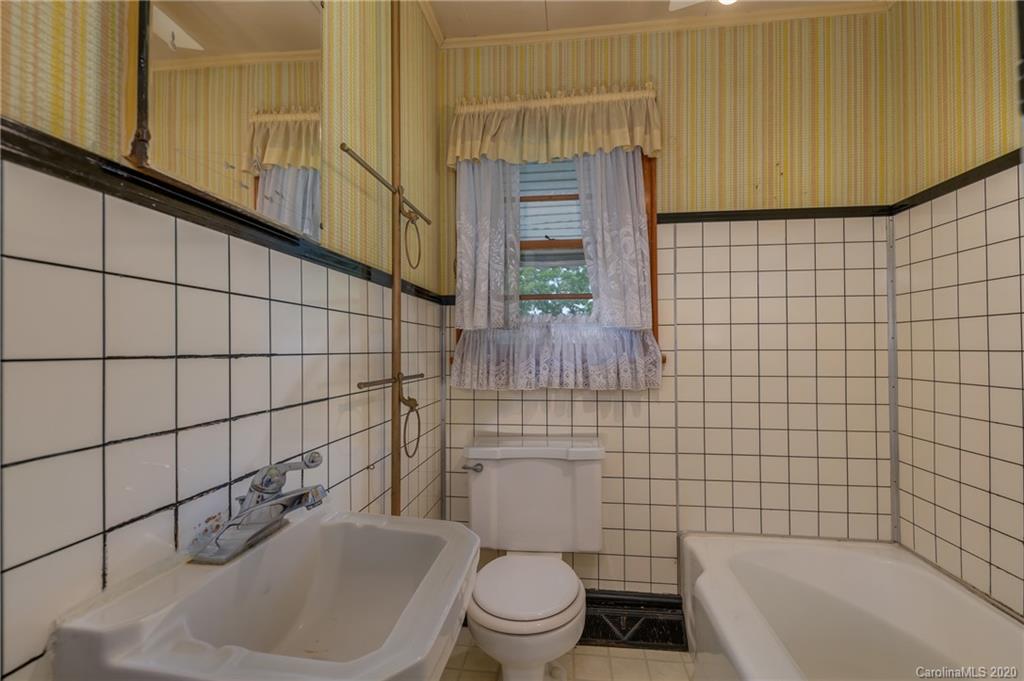 428 Kelly Road Forest City, NC 28043 - Photo 20 of 24 a bathroom with a sink a toilet and shower
