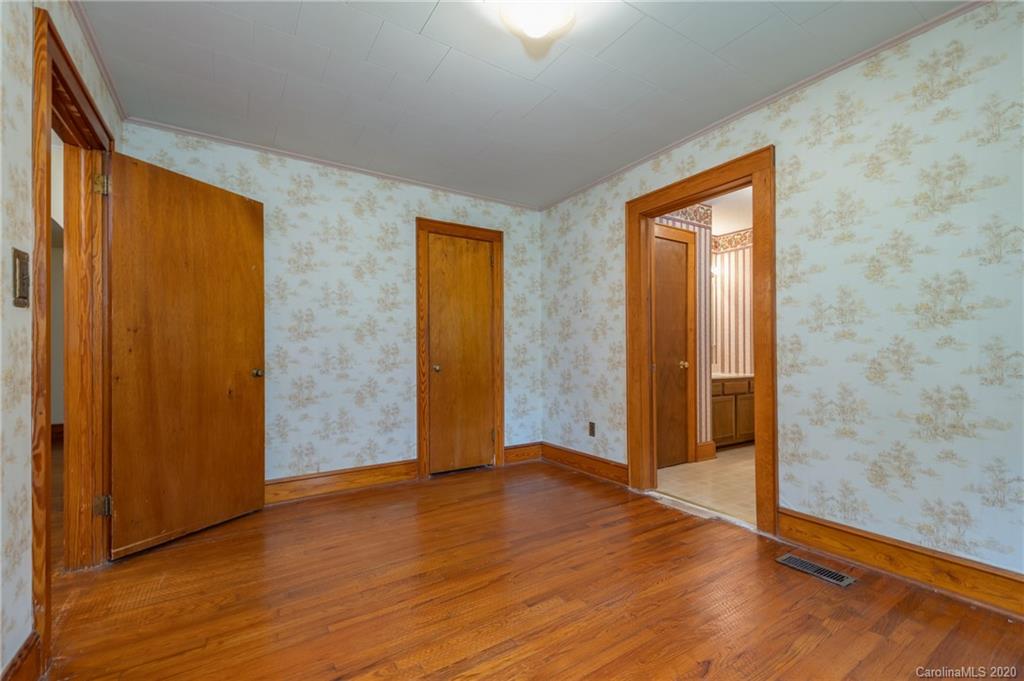 428 Kelly Road Forest City, NC 28043 - Photo 22 of 24 a view of an empty room with wooden floor and a window