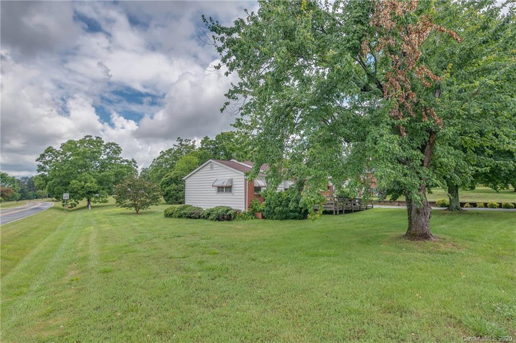 428 Kelly Road Forest City, NC 28043 - Photo 7 of 24 a view of a house with a yard and a large tree