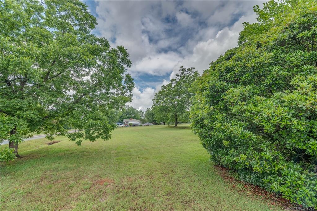 428 Kelly Road Forest City, NC 28043 - Photo 8 of 24 a view of a yard with a tree