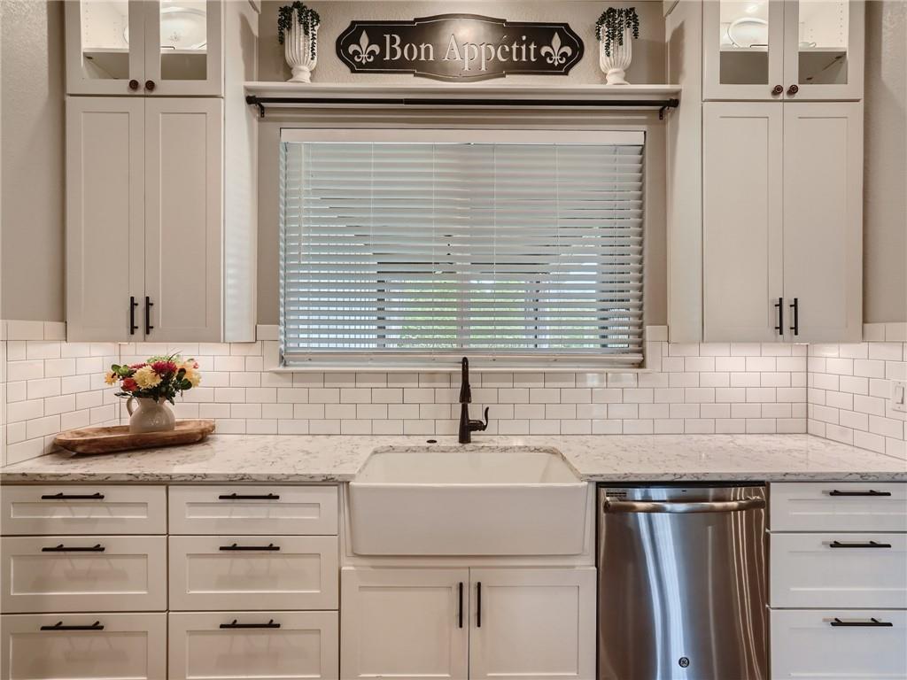 132 Huerta Road Florence, TX 76527 - Photo 11 of 40 White subway tile backsplash and crisp cabinetry define this immaculate kitchen.