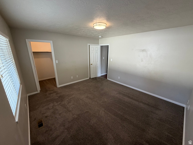 1563 South 600 East Springville, UT 84663 - Photo 15 of 30 Spacious interior room featuring neutral wall tones and dark carpeting