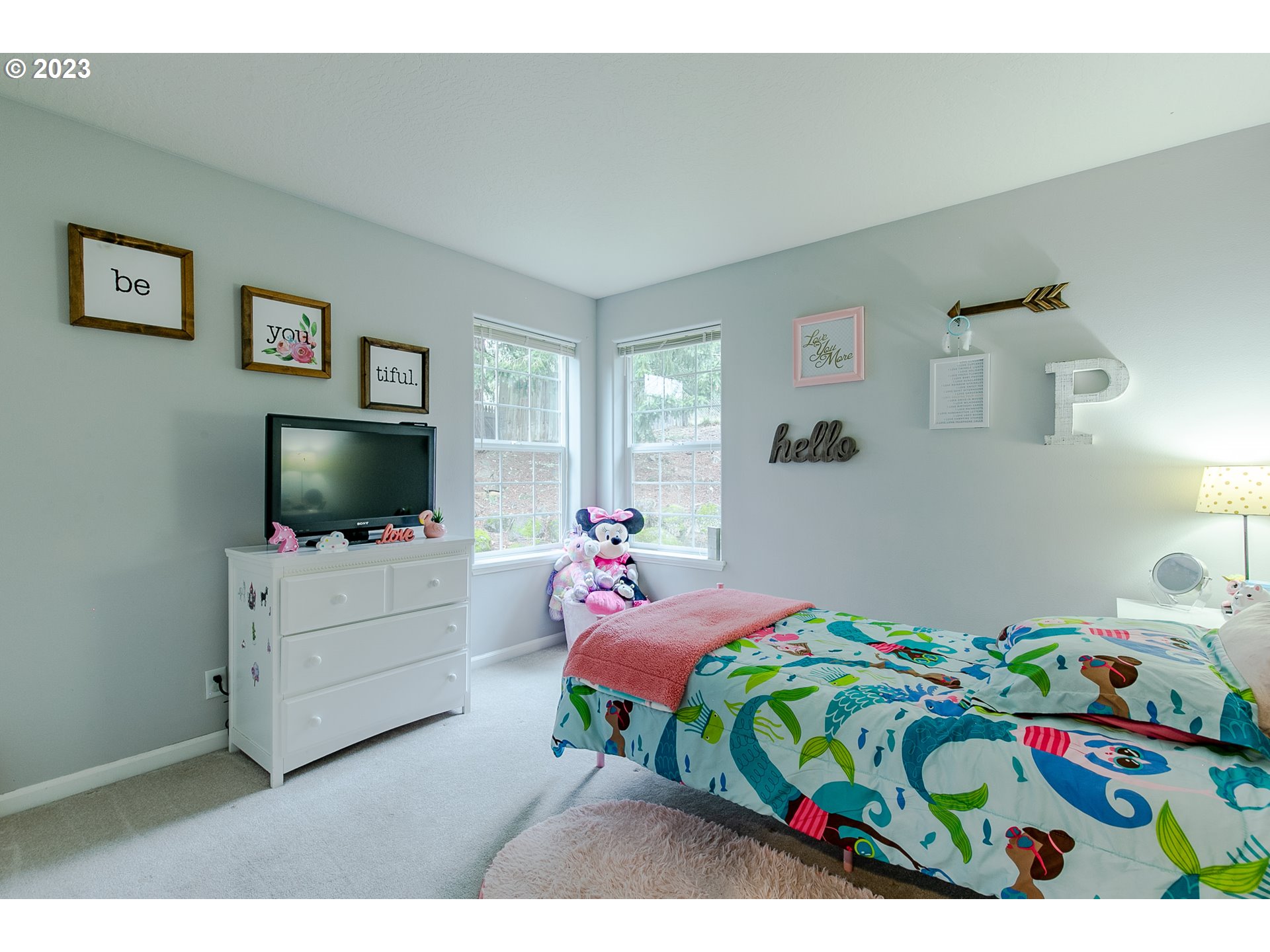 2353 35th Street Springfield, OR 97477 - Photo 15 of 32 a bedroom with a bed and a flat screen tv
