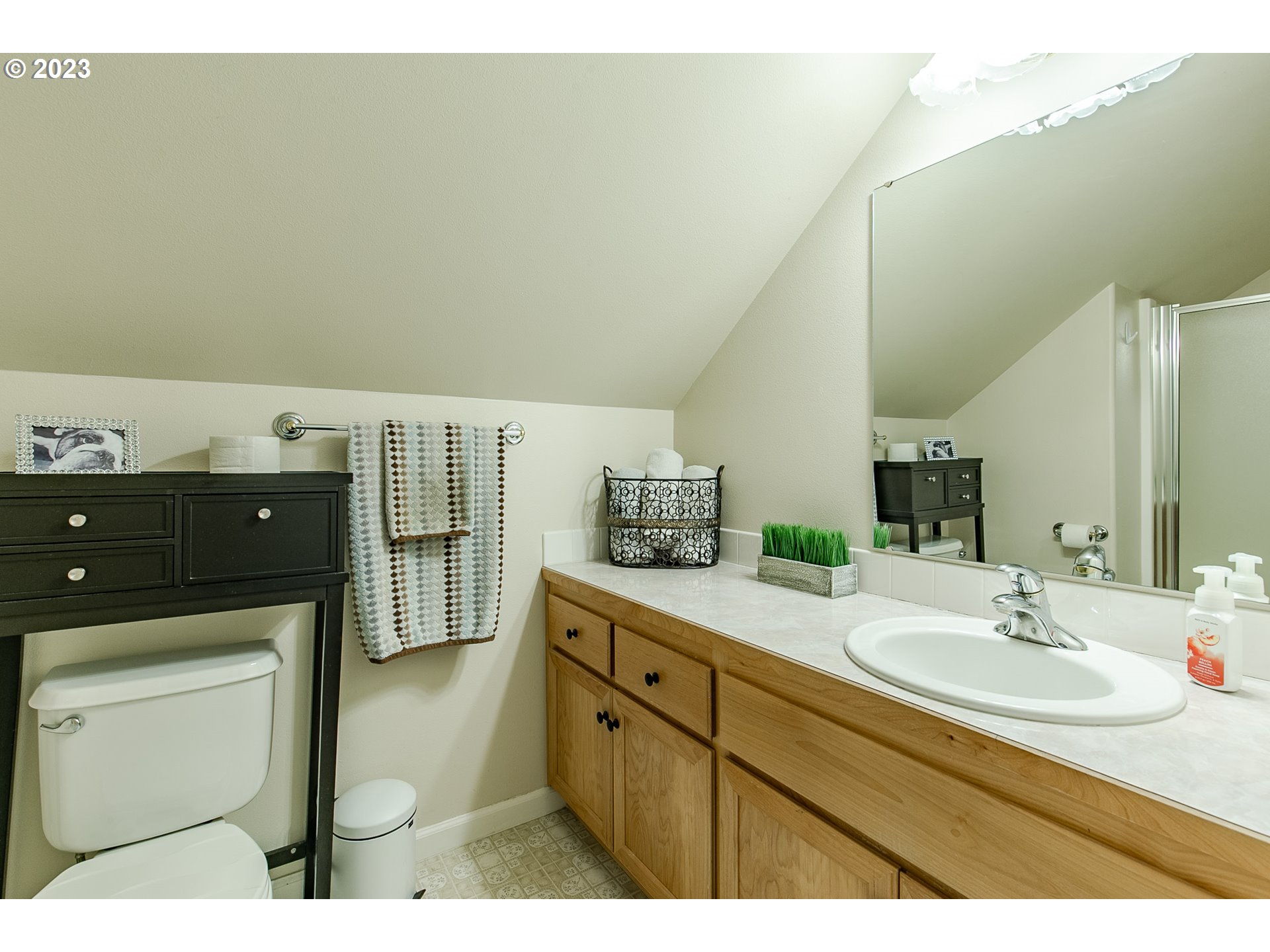 2353 35th Street Springfield, OR 97477 - Photo 26 of 32 a en suite bathroom with a sink double vanity and mirror