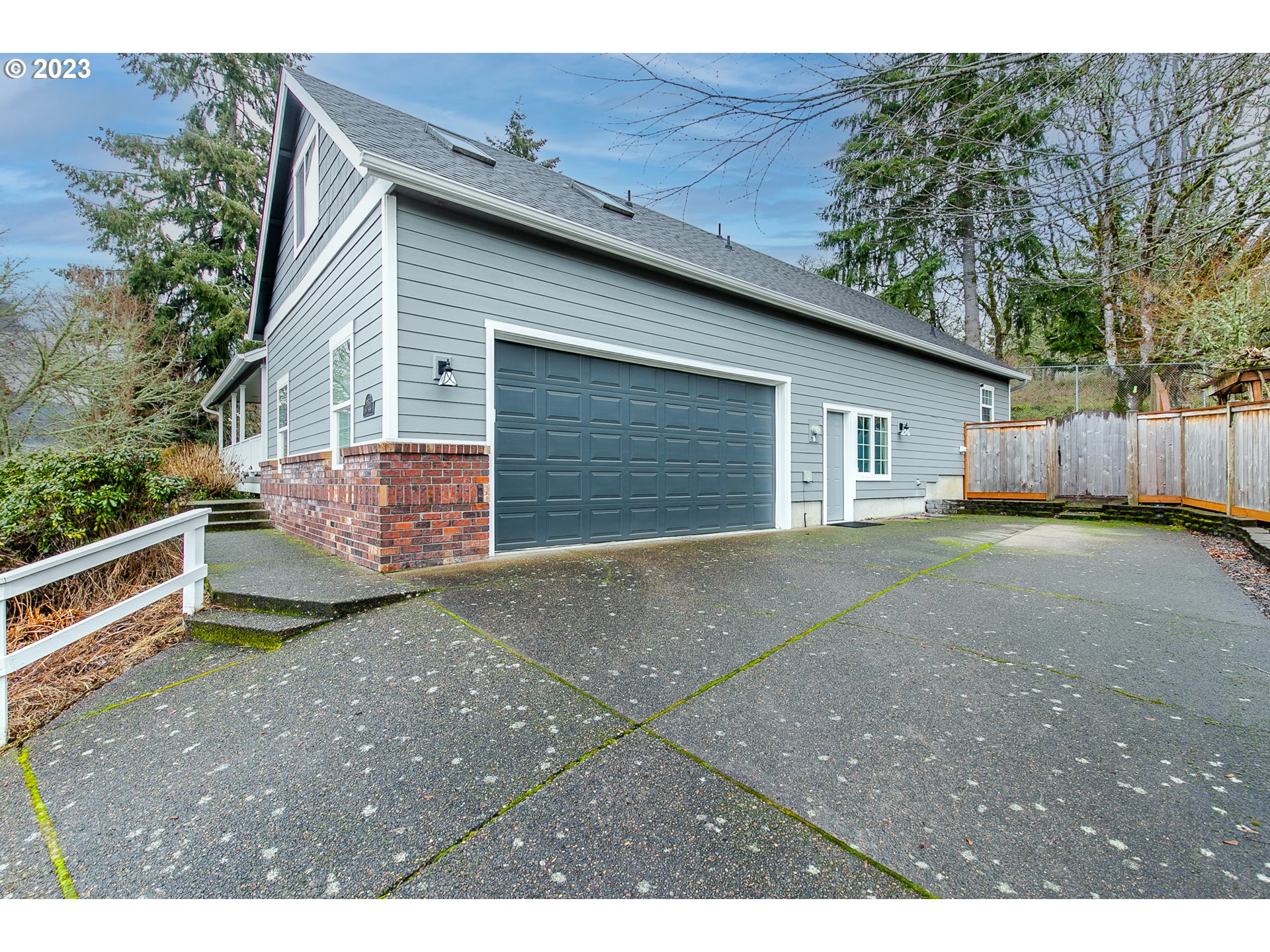 2353 35th Street Springfield, OR 97477 - Photo 3 of 32 a view of a backyard with a large tree