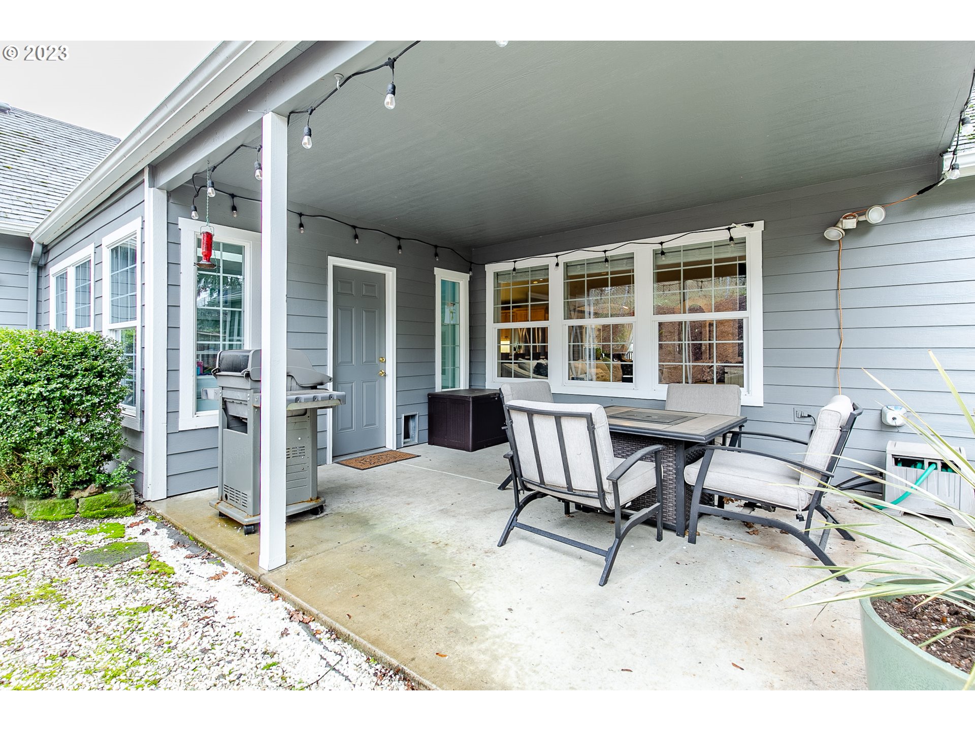 2353 35th Street Springfield, OR 97477 - Photo 31 of 32 a patio with table and chairs and potted plants