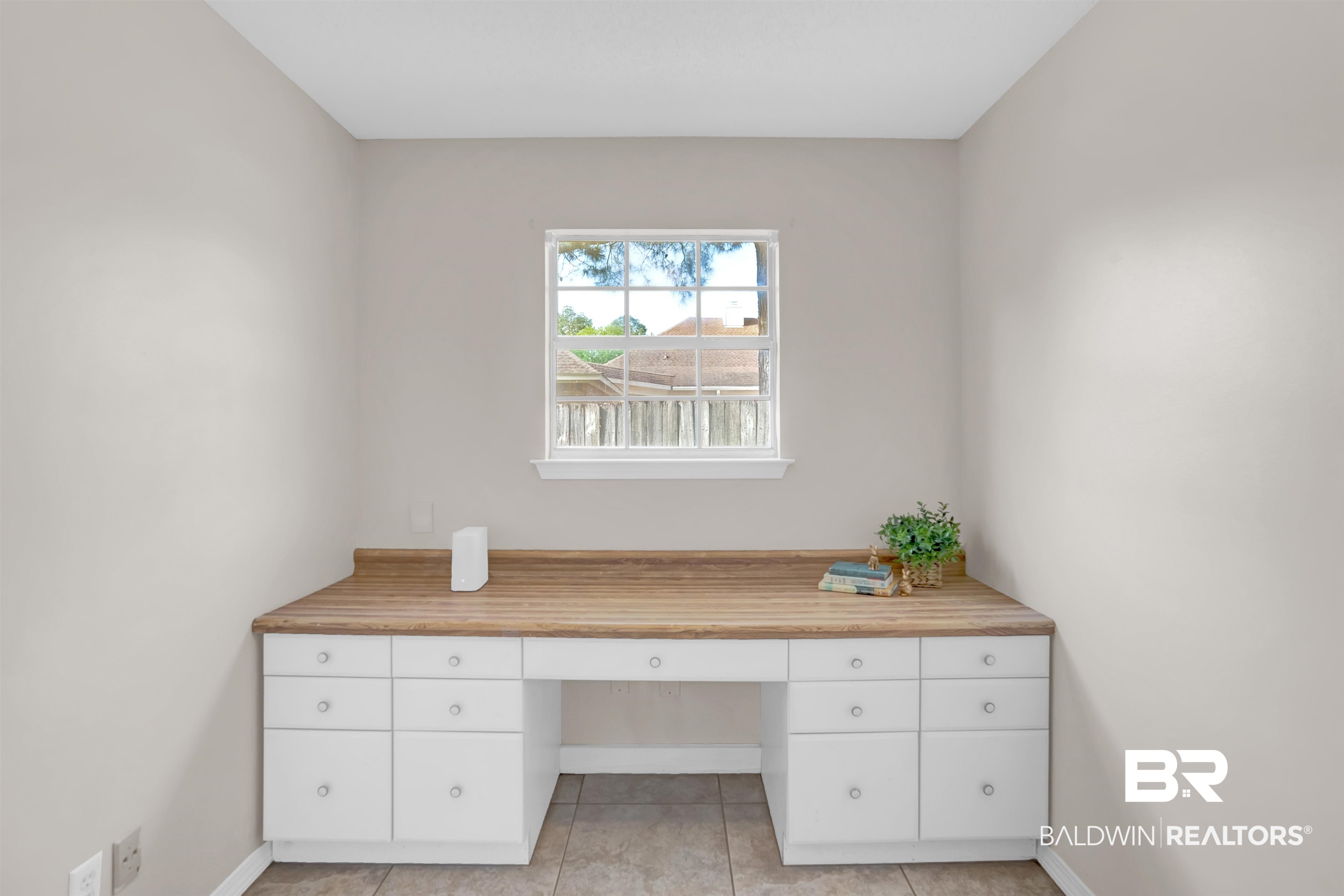 19741 Hunters Loop Fairhope, AL 36532 - Photo 27 of 42 Office space featuring light tile patterned floors, built in study area, and baseboards