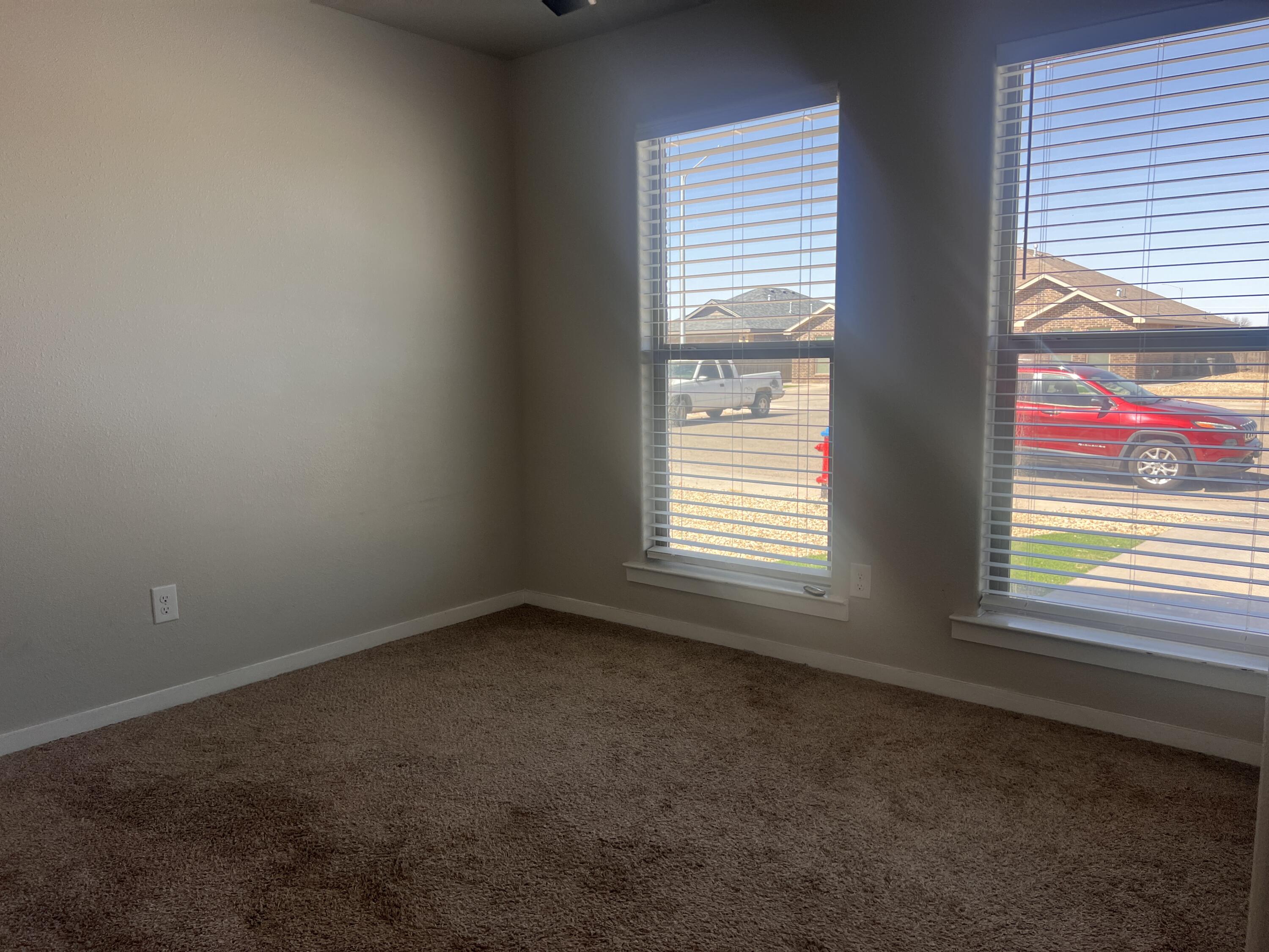 1637 133rd Street, Unit B Lubbock, TX 79423 - Photo 15 of 19 an empty room with a window