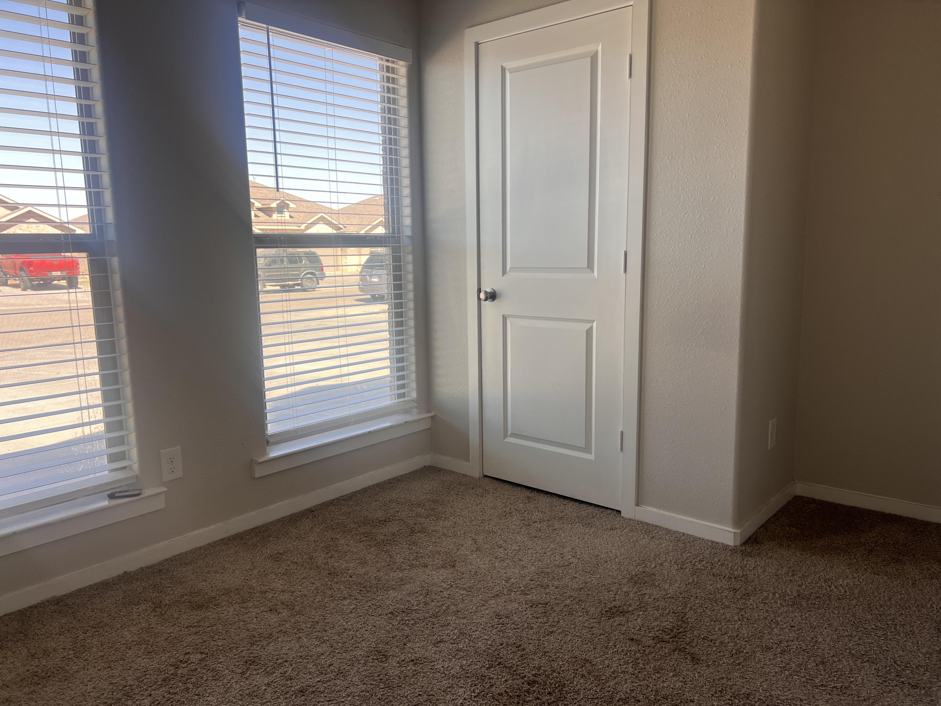 1637 133rd Street, Unit B Lubbock, TX 79423 - Photo 16 of 19 a view of an empty room with a window
