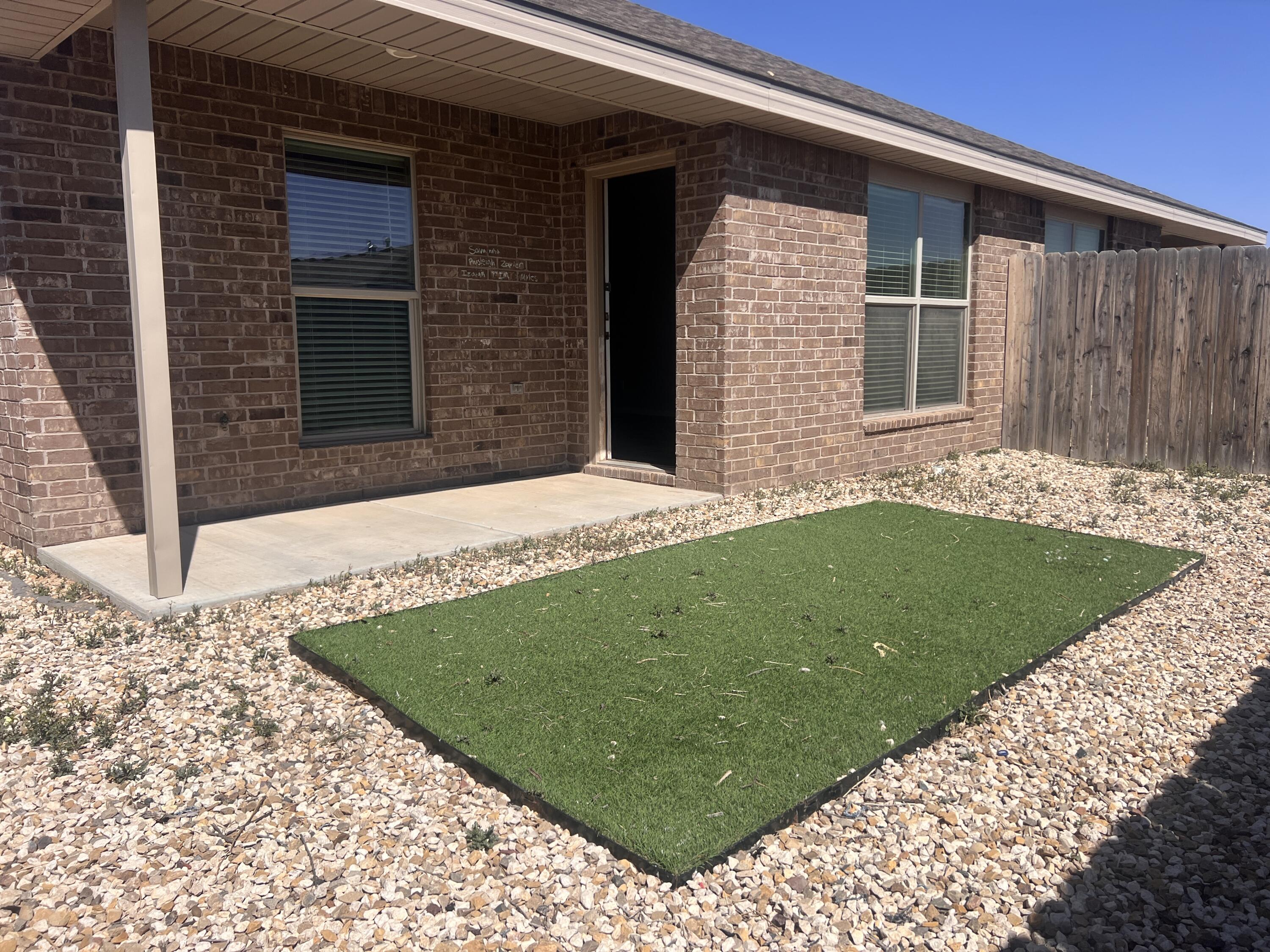 1637 133rd Street, Unit B Lubbock, TX 79423 - Photo 19 of 19 a backyard of a house with lots of green space