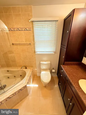 a bathroom with a bathtub and shower