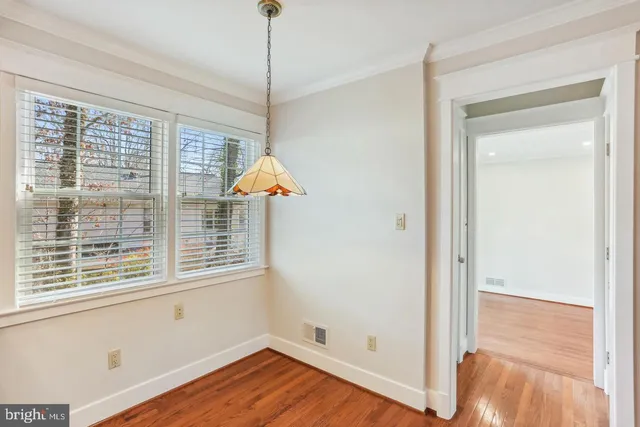 a bathroom with a granite countertop toilet sink and a mirror
