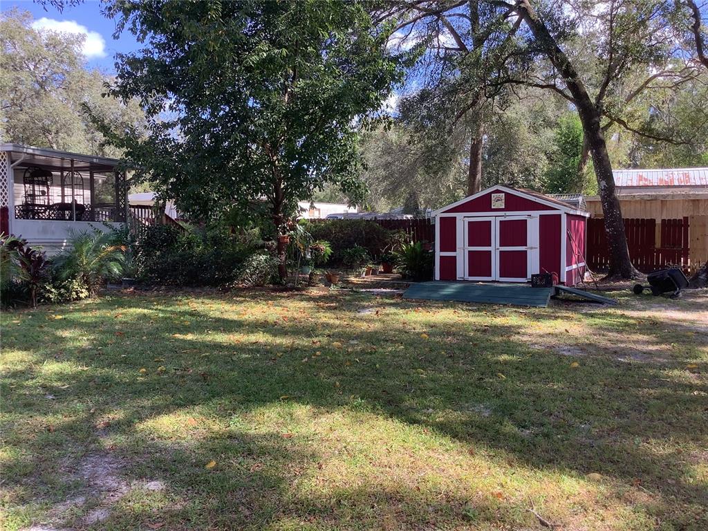 34926 Punch Road Dade City, FL 33523 - Photo 15 of 75 a view of a house with a yard