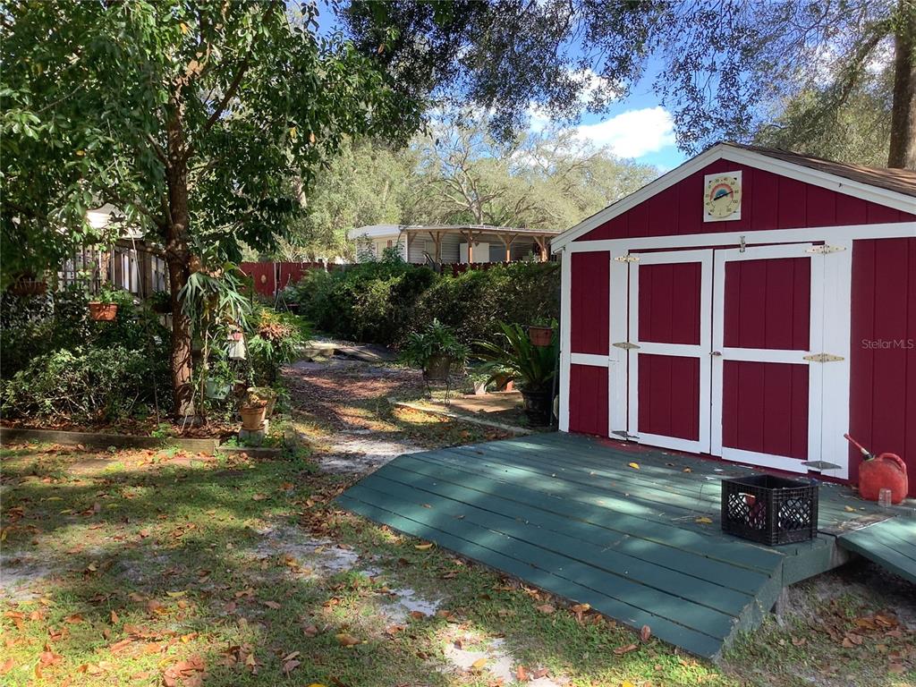 34926 Punch Road Dade City, FL 33523 - Photo 20 of 75 a view of a house with a yard