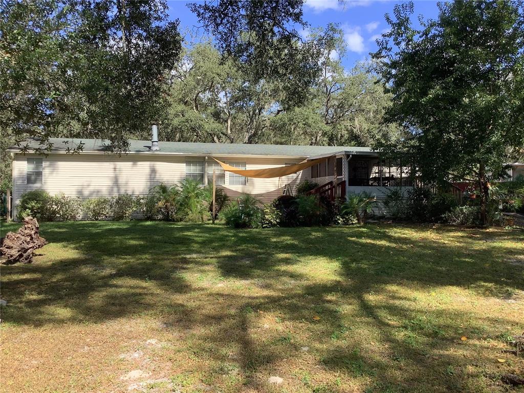 34926 Punch Road Dade City, FL 33523 - Photo 5 of 75 a view of a fountain in front of a house