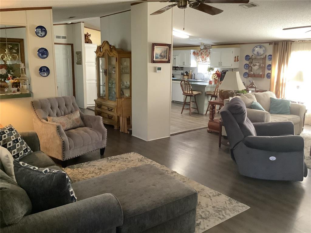 34926 Punch Road Dade City, FL 33523 - Photo 54 of 75 a living room with furniture and wooden floor
