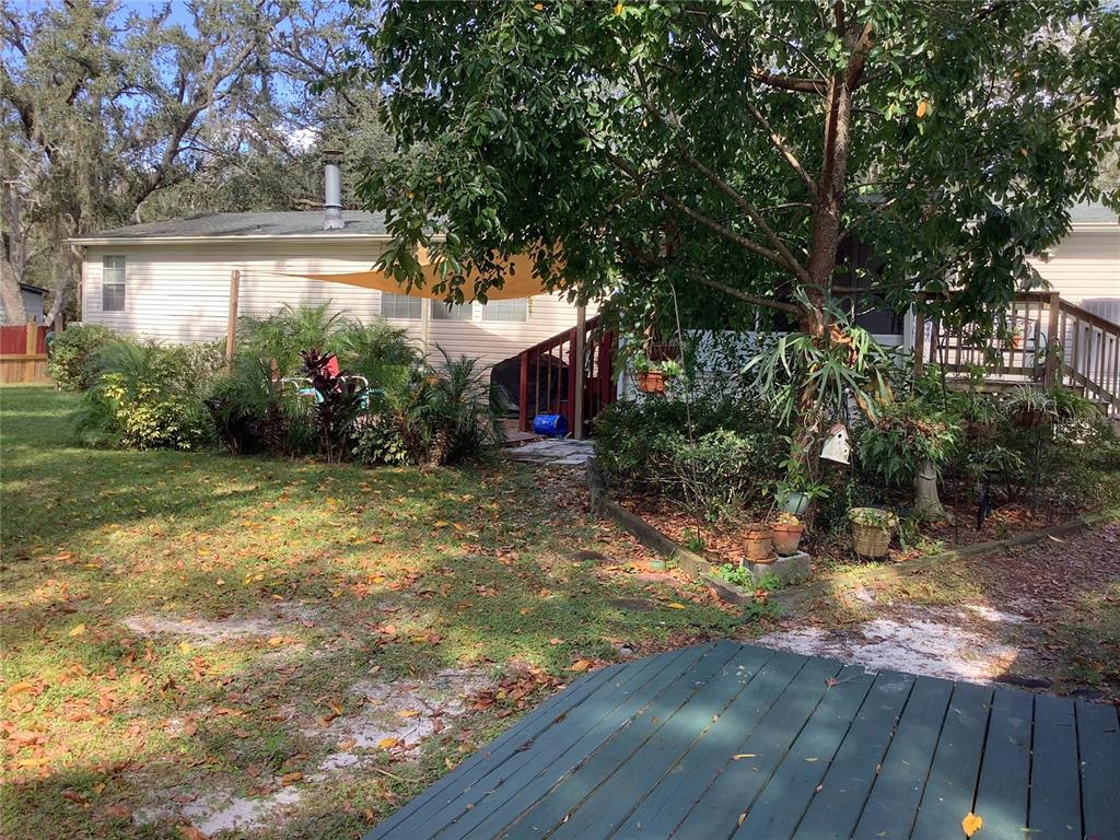 34926 Punch Road Dade City, FL 33523 - Photo 8 of 75 a view of a house with a backyard