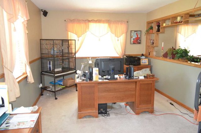 458 East Briarcliff Road Bolingbrook, IL 60440 - Photo 13 of 18 a living room with furniture a window and a table