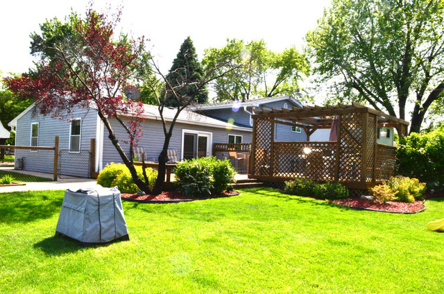 458 East Briarcliff Road Bolingbrook, IL 60440 - Photo 15 of 18 a front view of a house with garden and porch