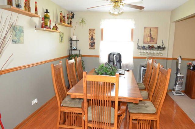458 East Briarcliff Road Bolingbrook, IL 60440 - Photo 3 of 18 a view of a dining room with furniture wooden floor and chandelier