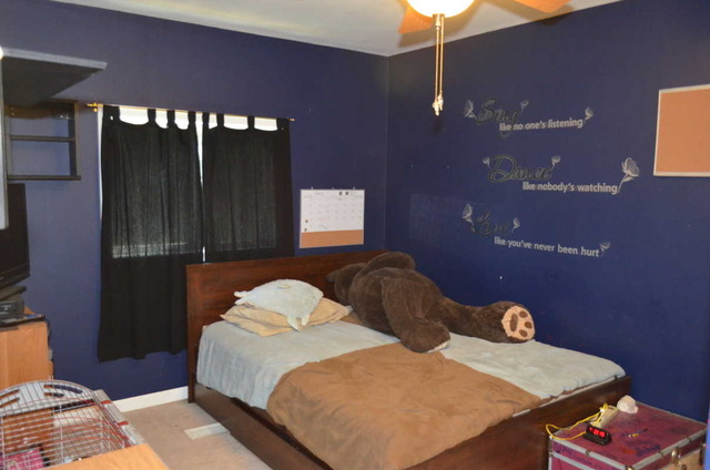 458 East Briarcliff Road Bolingbrook, IL 60440 - Photo 10 of 18 a bedroom with a bed and a lamp