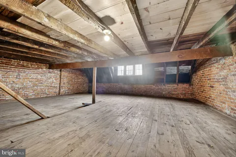 a view of an empty room with windows