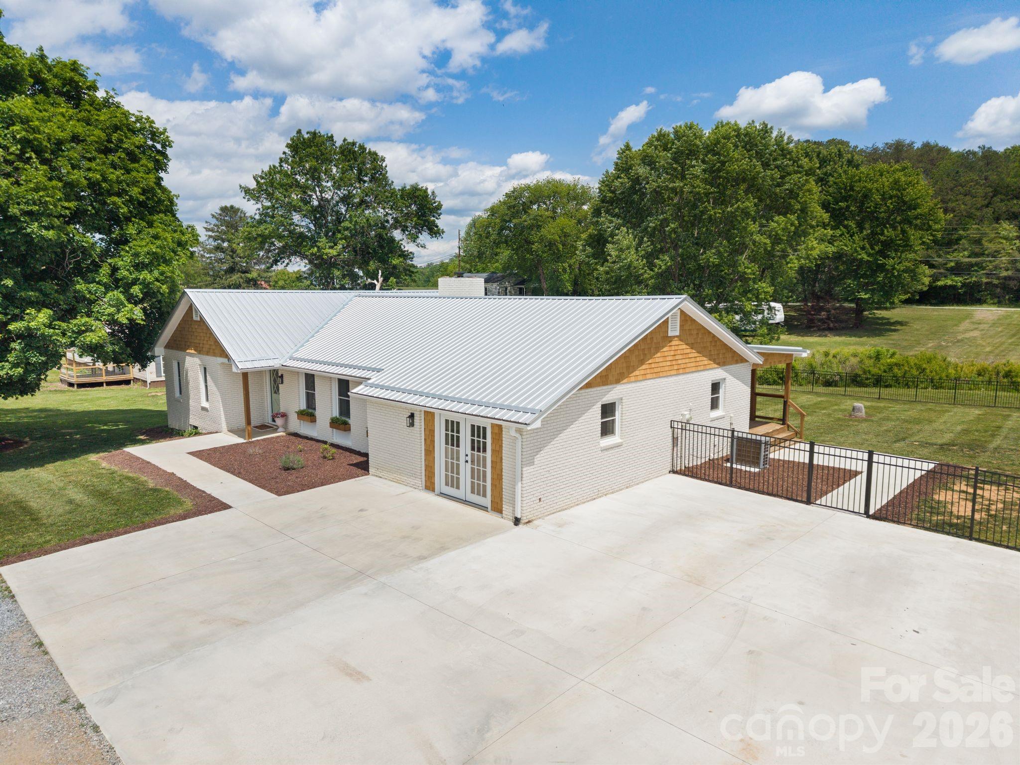97 Paul Holland Road Canton, NC 28716 - Photo 4 of 35 a front view of a house with yard and green space
