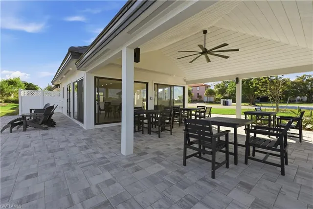 a view of a dining room and livingroom with furniture garden view and a patio