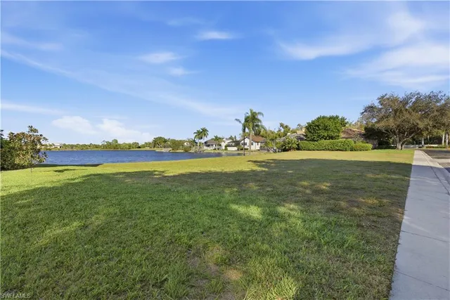 a view of a lake with a big yard